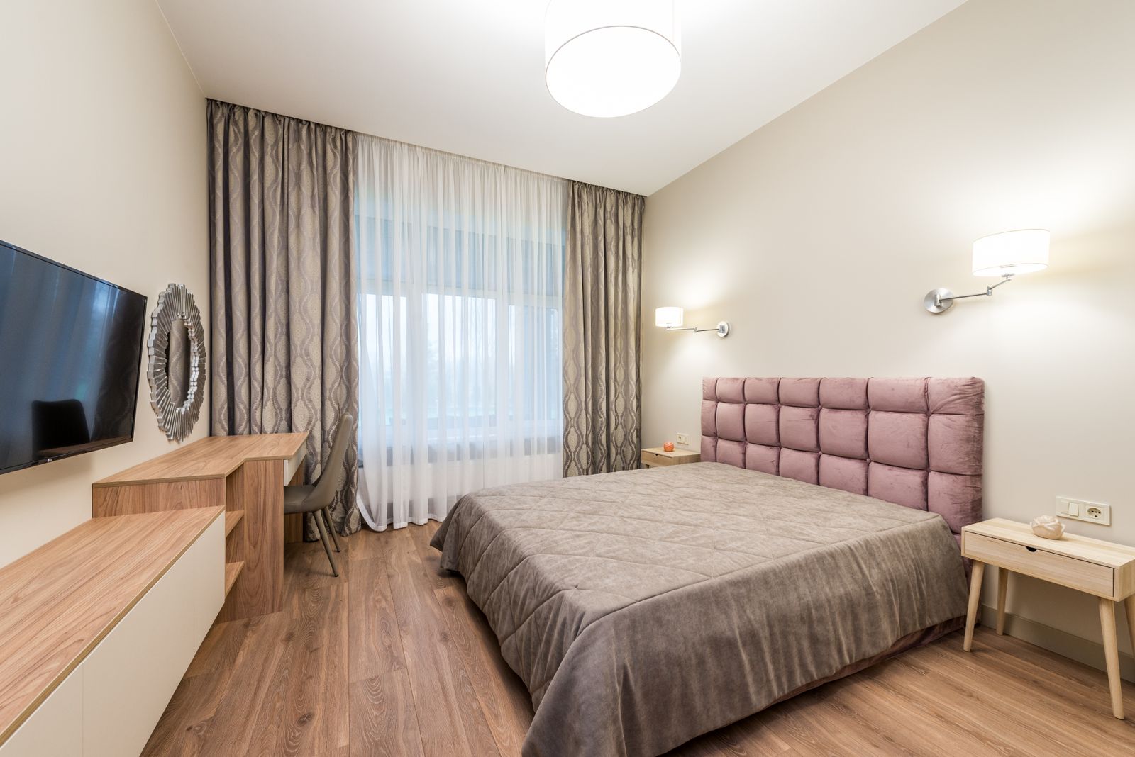 Grey blockout curtains with sheers in a bedroom
