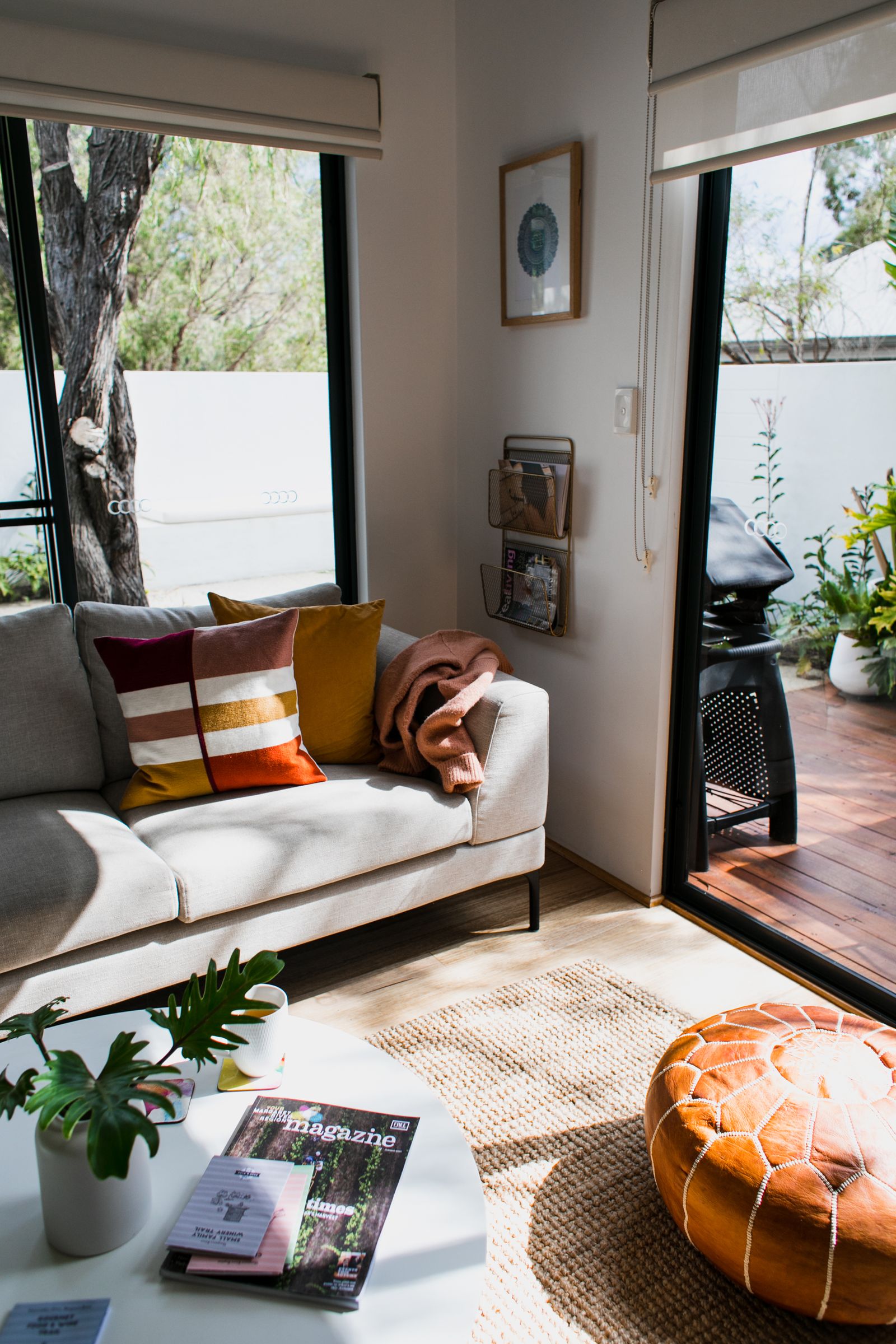 Roller blinds and sheers in a sunlit sitting room